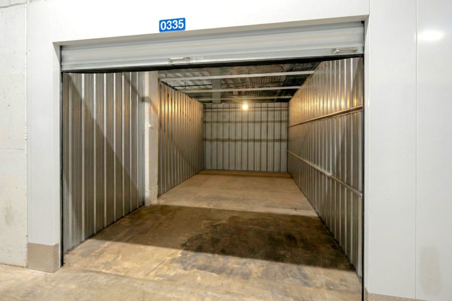 Large storage unit Aurora IL with roll-up door open and clean interior space