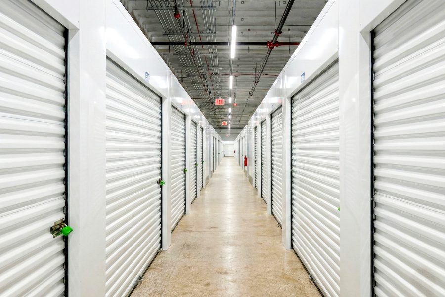 Long indoor self storage Aurora IL hallway with rows of roll-up storage unit doors